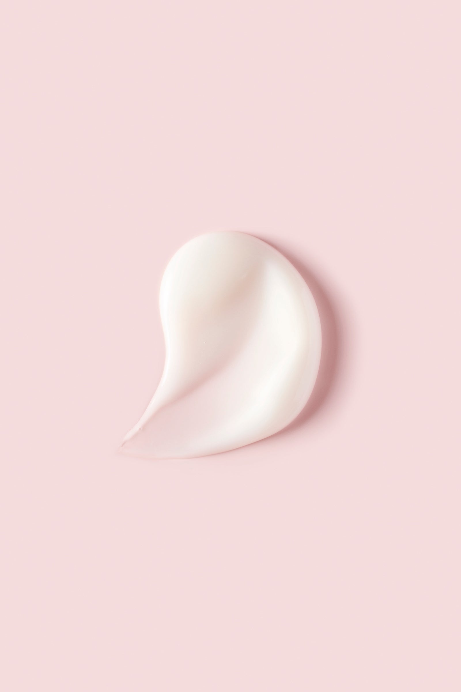 Portion of Advanced Climate Control® Featherlight Styling Cream on pink background