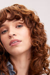 Model with red curly hair