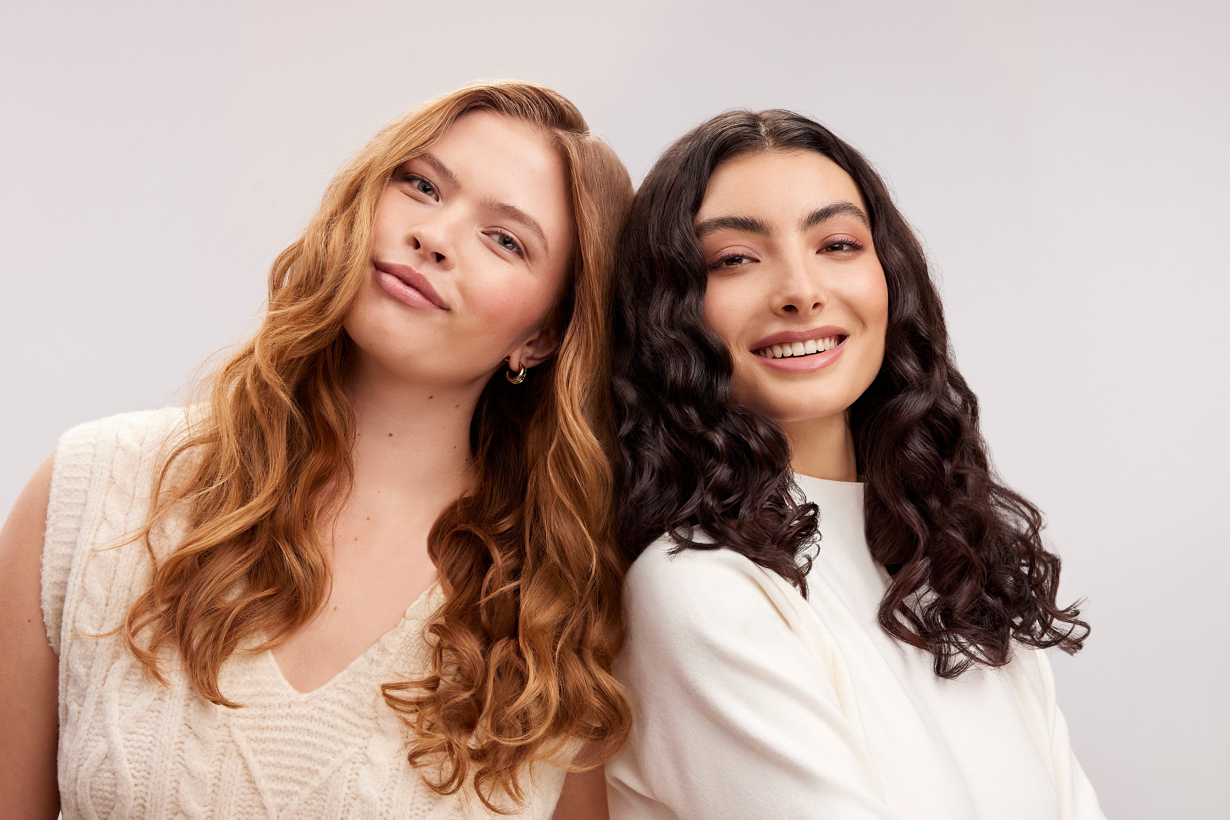 2 models with curly hair