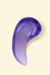 Portion of Tone It Away® Purple Shampoo on light yellow background