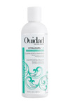 Bottle of Ouidad VitalCurl®+ Clear & Gentle Shampoo on white background